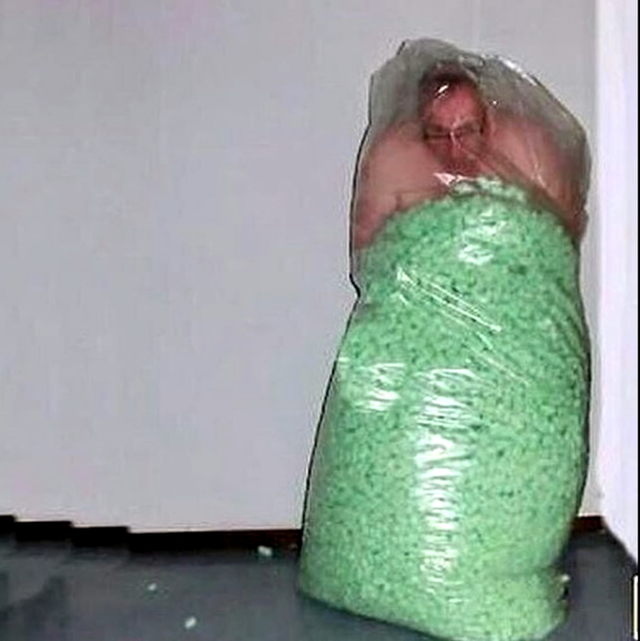 cursed-images-green-man-in-a-bag